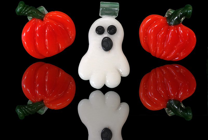 Flameworked glass ghost and pumpkin pendants