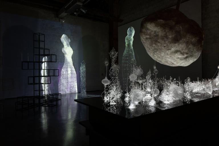 Image of installation artwork by Kim KototamaLune that includes glass plants and figures