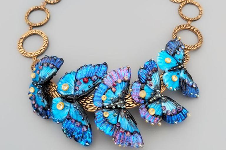 Glass butterflies on a necklace by artist Oksana Puzhalova