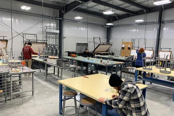 Students working in the kiln studio area