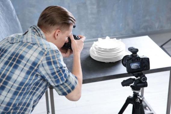 Man taking photographs in a photography studio