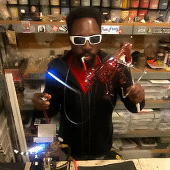 Chris Mosley, Graduate of Scientific Glass Technology, working on a glass object with a torch